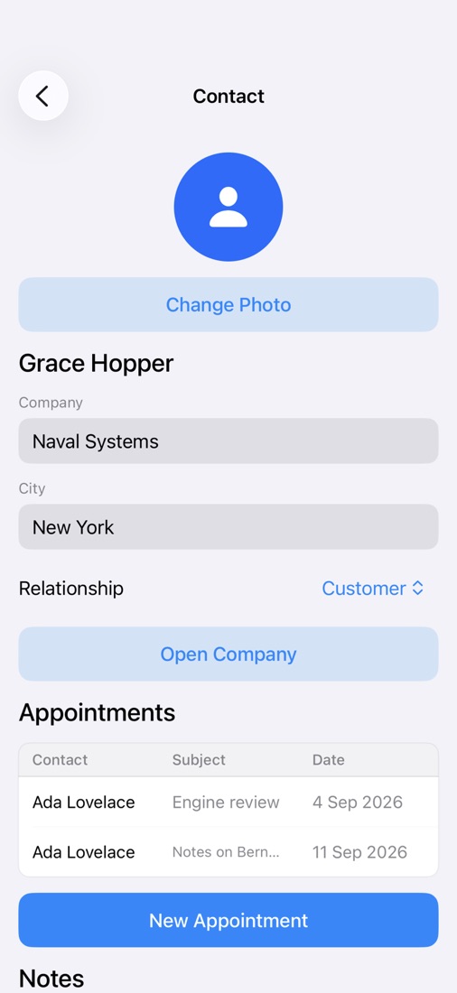 An iPhone showing a customer detail screen with fields, a map and a list of related records