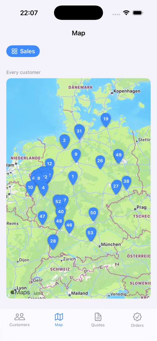 An iPhone showing a map of Germany with numbered pins for every customer, a tab bar at the foot